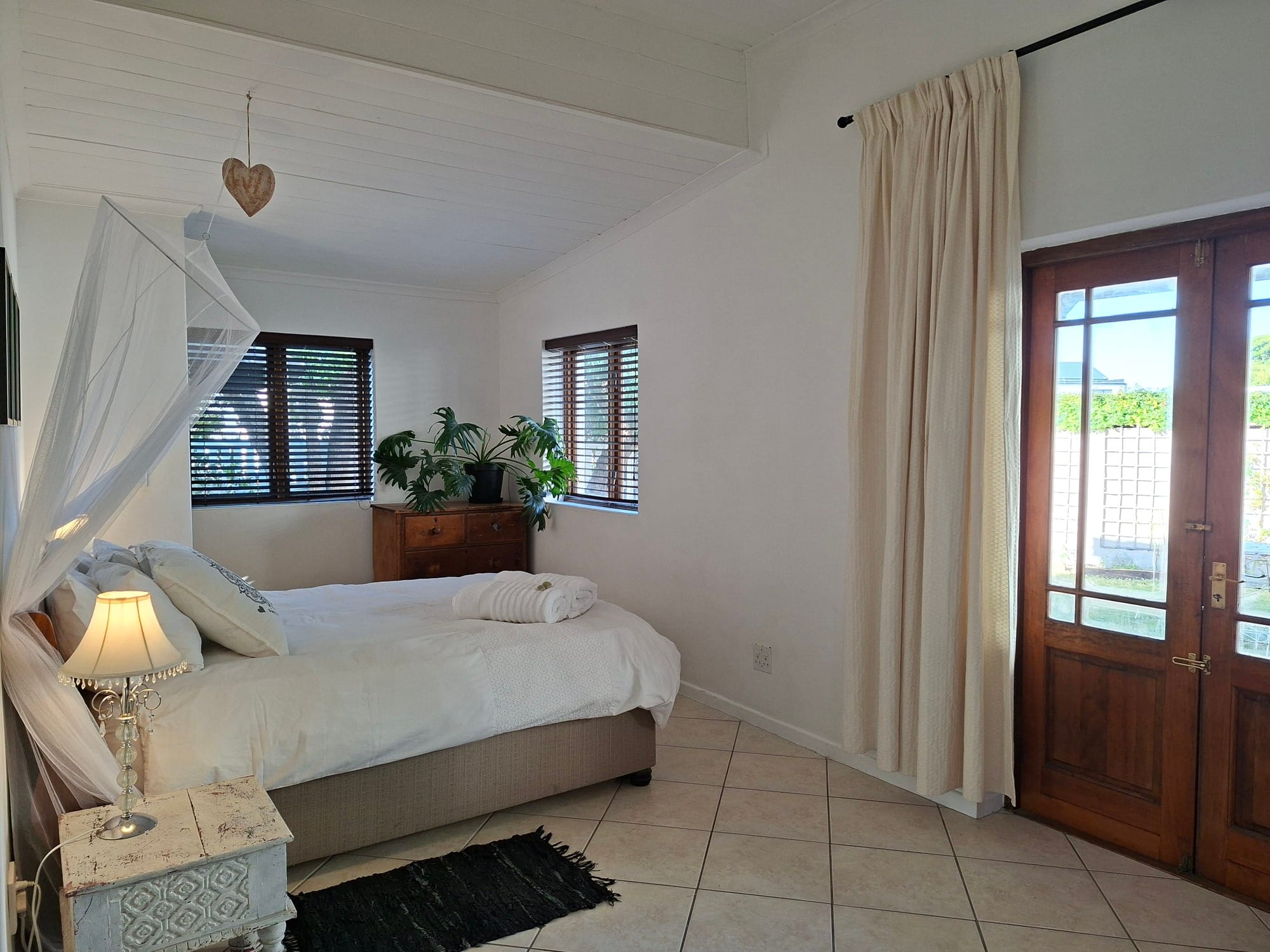The bright and sunny main bedroom of the home Songbird in Yzerfontein